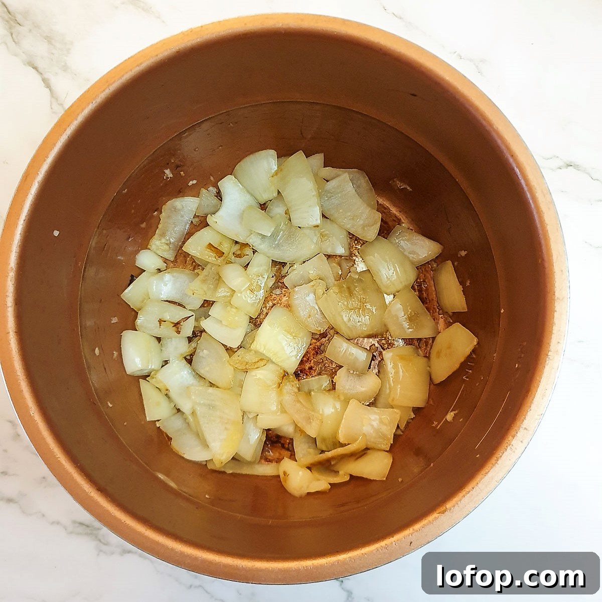 Onions frying in a presssure cooker.