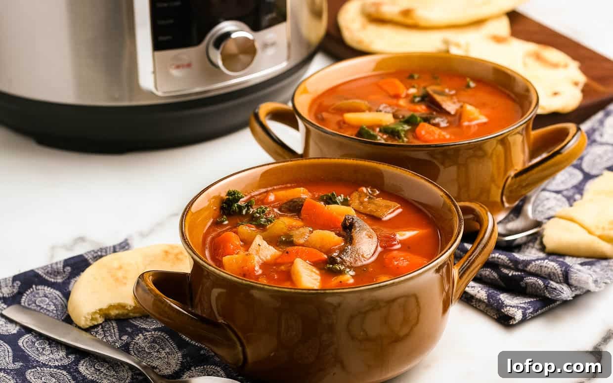 12 Flavor-Packed Meatless Dinners You’ll Love Tonight 9 Two bowls of instant pot vegetable soup in front of the pressure cooker.