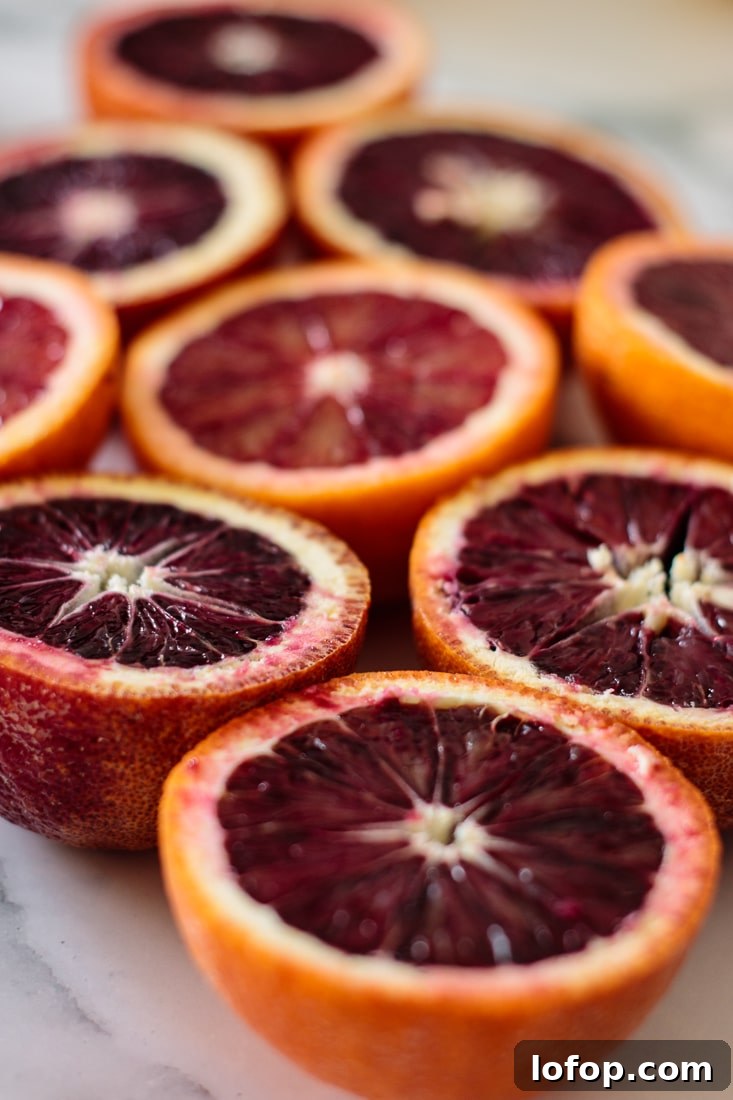 Winter Blood Orange Lemonade Recipe — Refreshing Citrus Drink 3 Blood oranges halves.