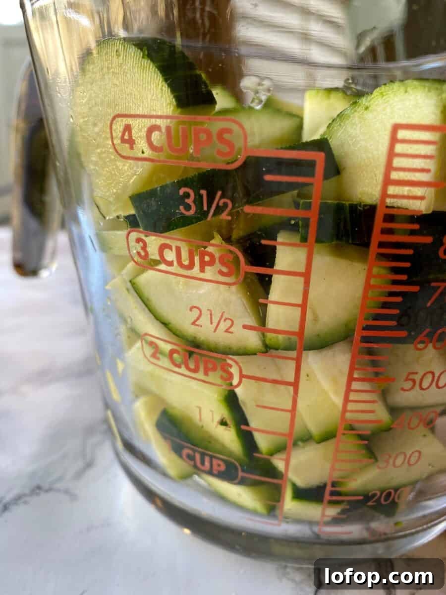 Zucchini and Herb Stuffing Casserole Recipe 4 Diced zucchini in a 4-cup glass measuring cup.