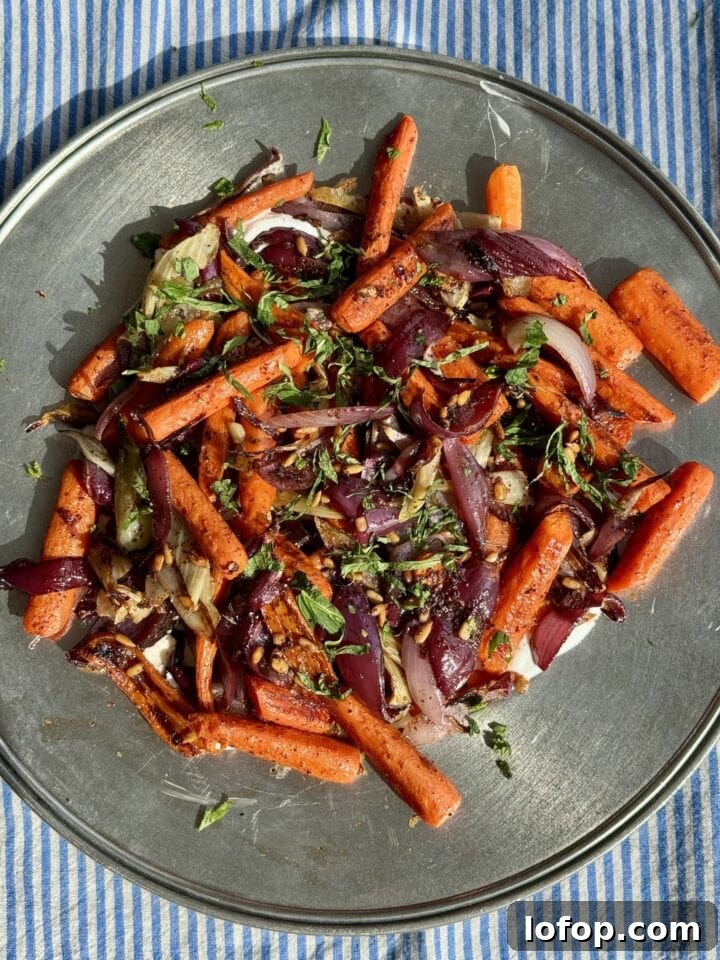 roasted carrot salad on a metal platter