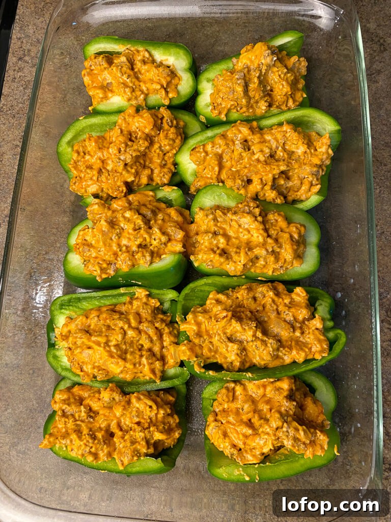 Creamy Pizza-Stuffed Bell Peppers Recipe for Weeknight Dinner 8 Cream cheese and meat pizza filling in green pepper halves