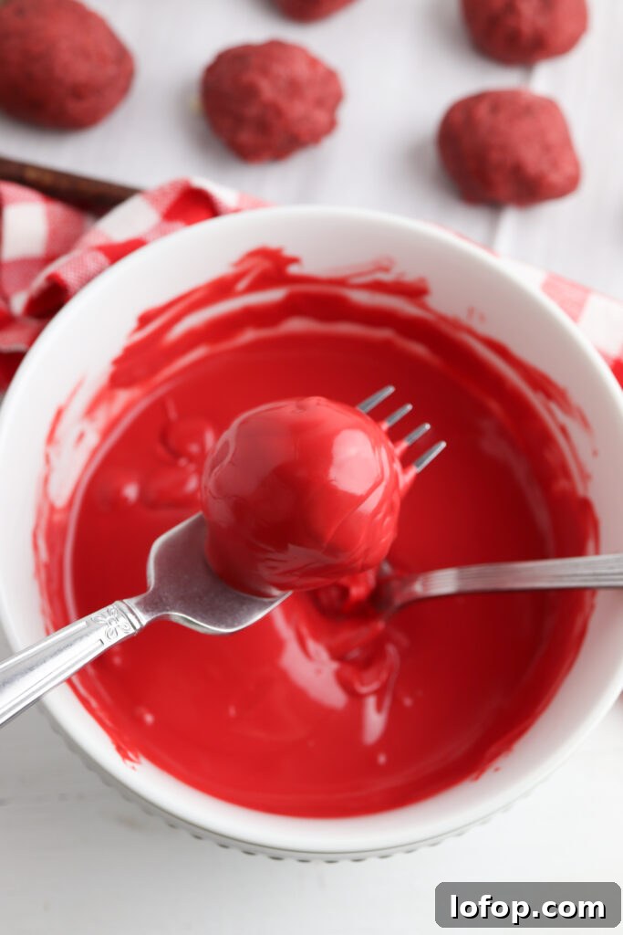 Dipping cake balls in candy coating