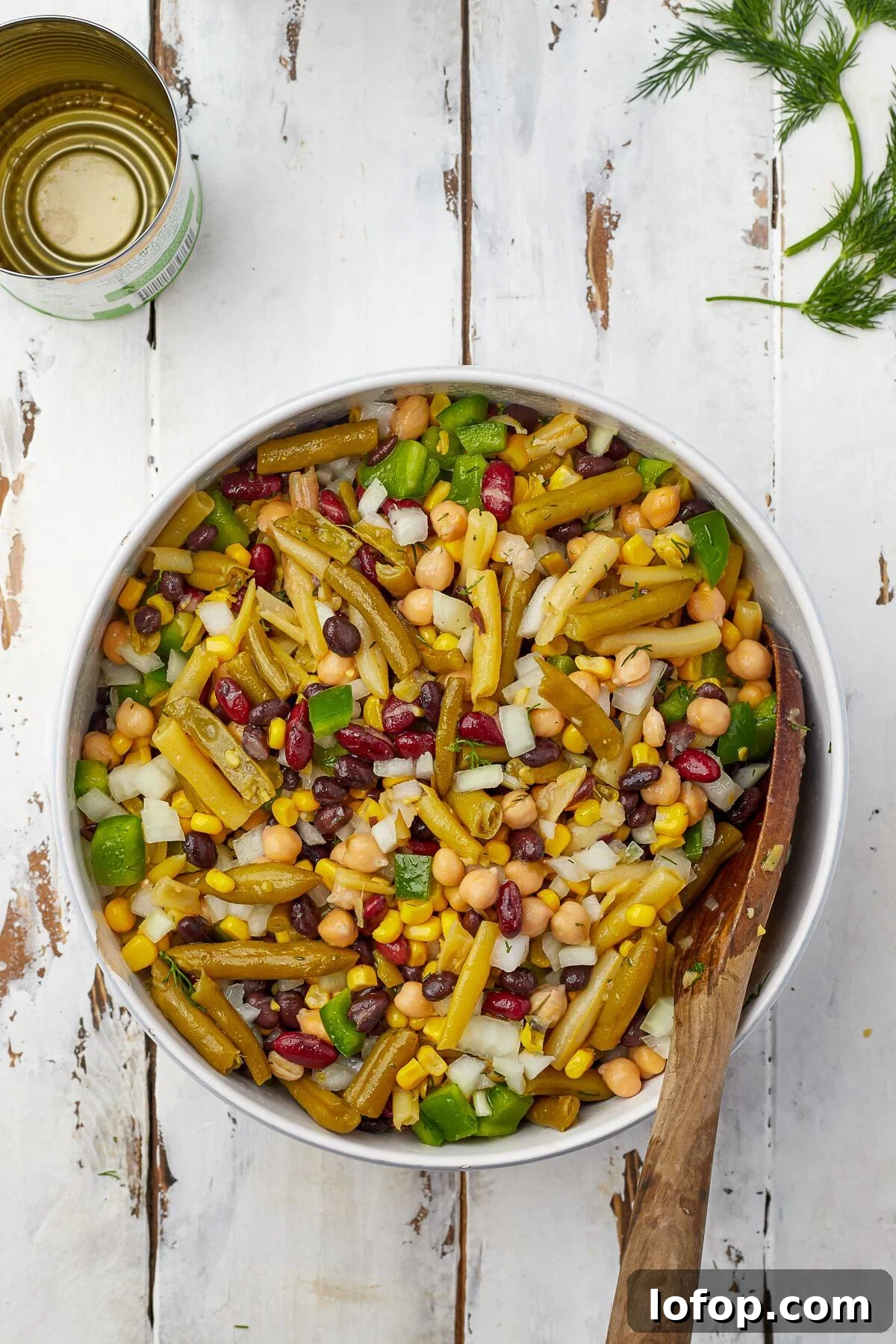 Creamy Vinaigrette Five-Bean Salad Recipe 6 Bean salad tossed with vinaigrette dressing in a bowl.
