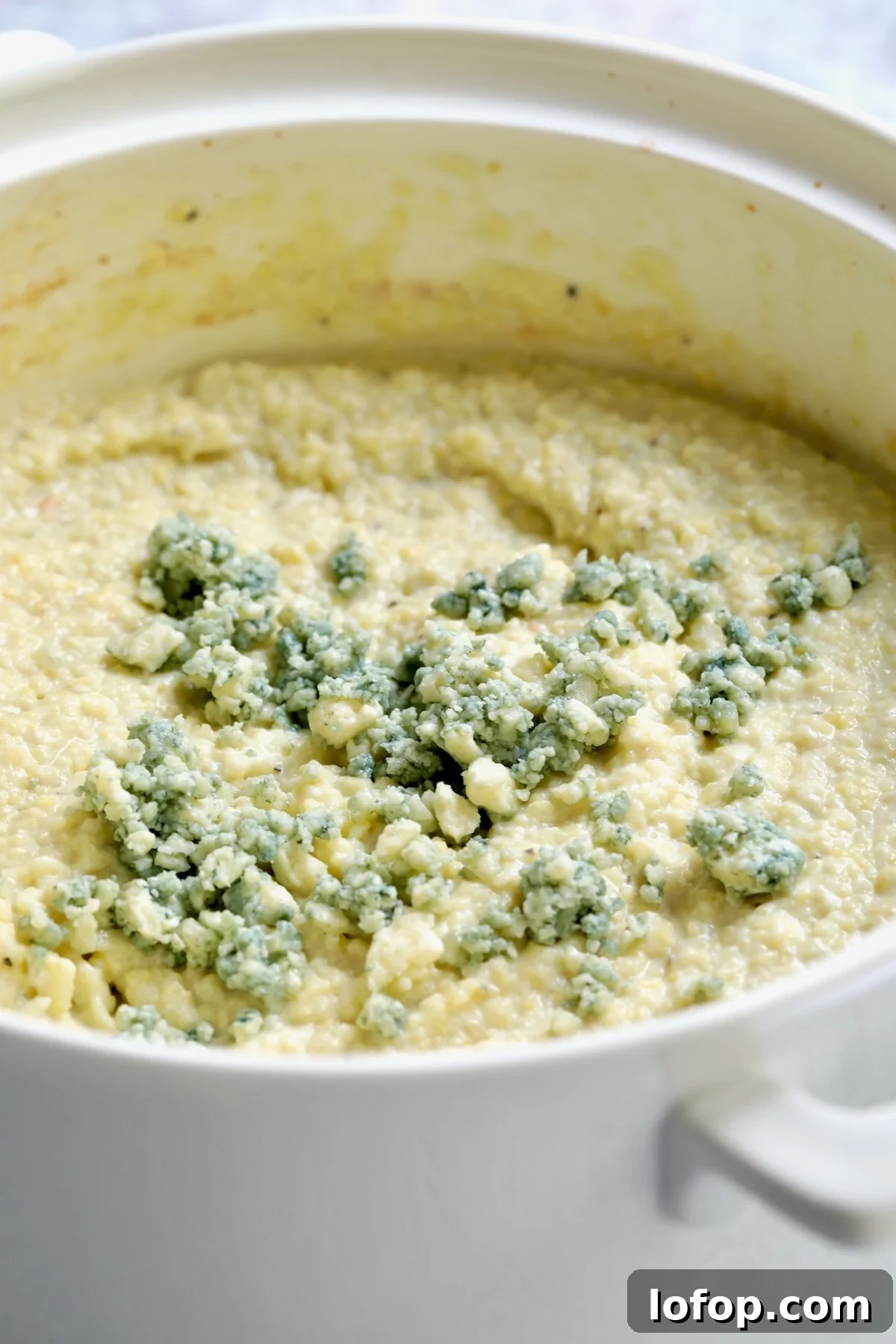 Authentic Stracotto: Italian Pot Roast Recipe for Slow-Cooked Beef 6 Gorgonzola Polenta in white ceramic baking dish.