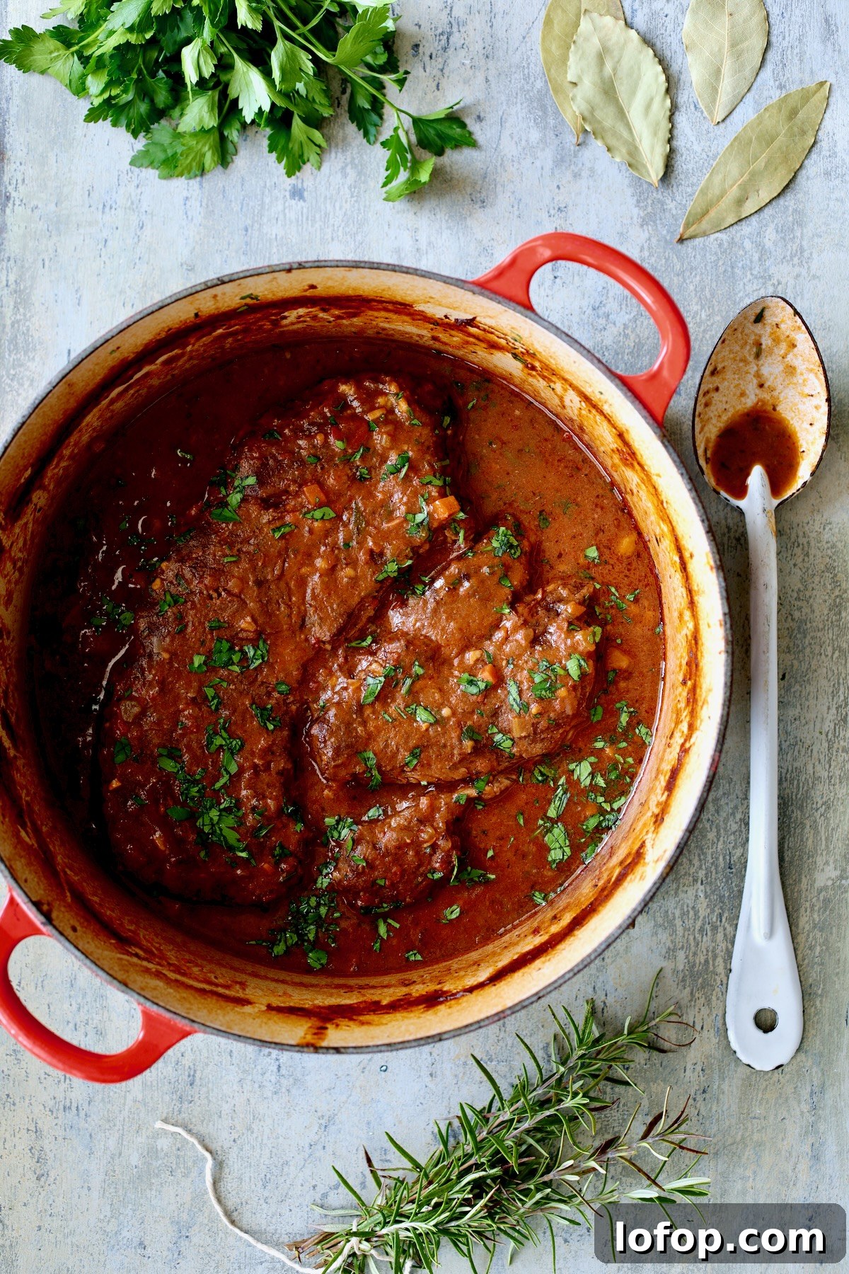 Authentic Stracotto: Italian Pot Roast Recipe for Slow-Cooked Beef 7 Italian Pot Roast (Stracotto) in red enamel cast iron Dutch oven after being braised.