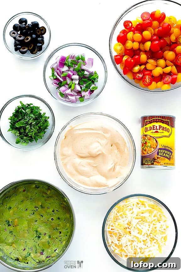 7 Layer Dip -- a fresh recipe for this classic dip that's always a crowd-pleaser! | gimmesomeoven.com #appetizer #gameday