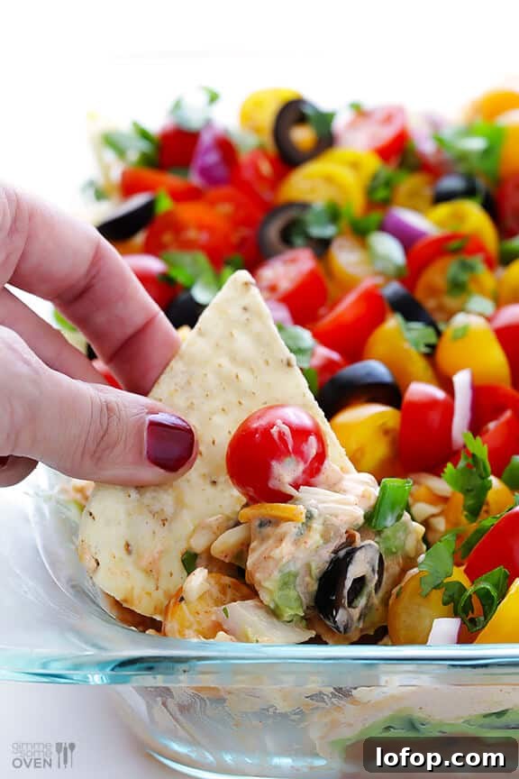 7 Layer Dip -- a fresh recipe for this classic dip that's always a crowd-pleaser! | gimmesomeoven.com #appetizer #gameday