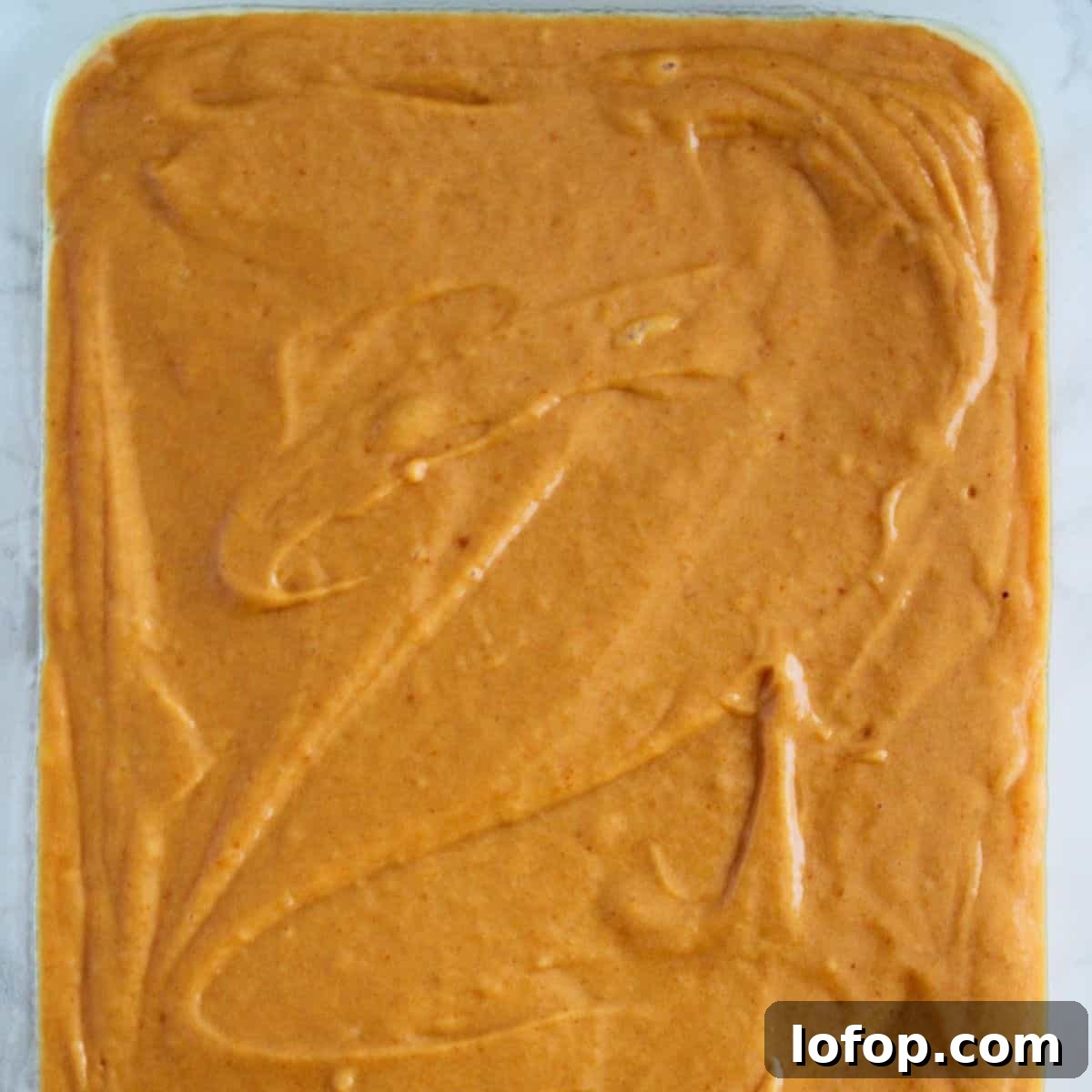 Pumpkin bar batter in a pan.