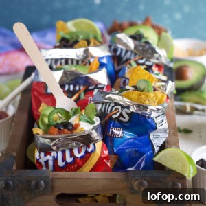 Walking Tacos: Easy Portable Taco Cups for Parties and Picnics 6 Multiple walking tacos are presented on a white surface.