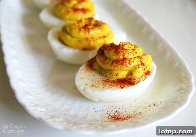 23 Last-Minute Thanksgiving Ideas for Activities, Recipes & Events 12 Curried Deviled Eggs on white plate