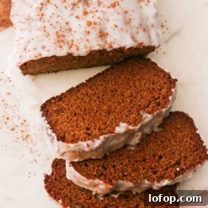 slices of gluten free gingerbread loaf with a white backround
