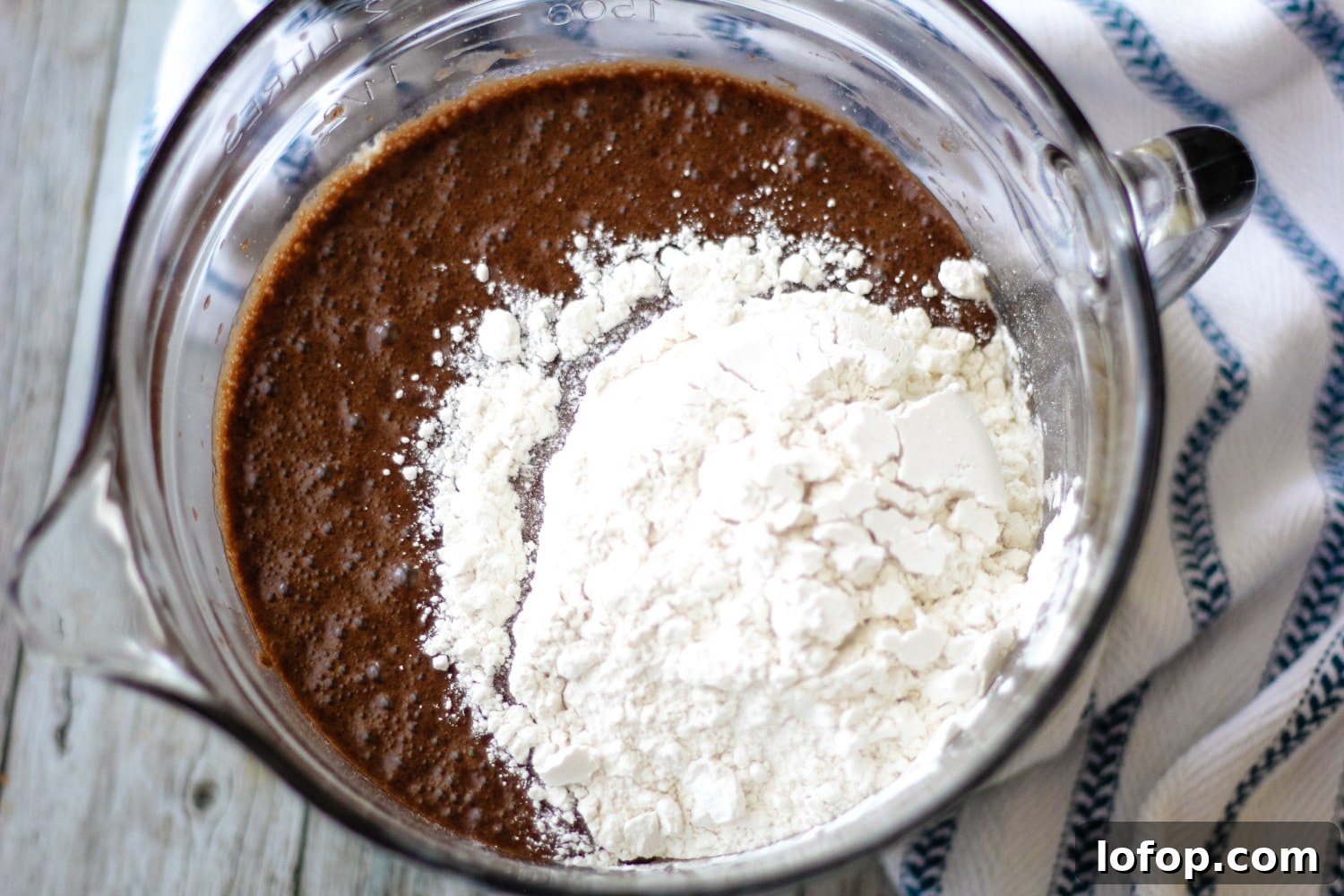 Classic Mississippi Mud Cake Recipe from Grandma's Kitchen 3 ingredient for mississippi mud cake frosting in a bowl