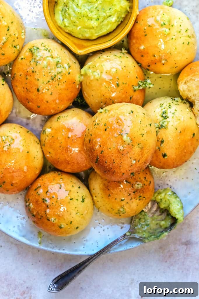 Close up on dough balls served with garlic butter on a plate