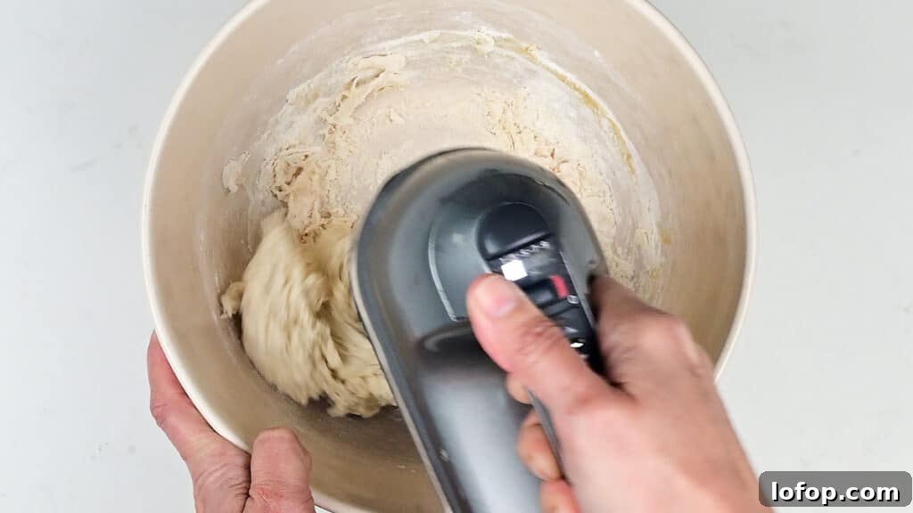 mixing dough with an electric hand mixer