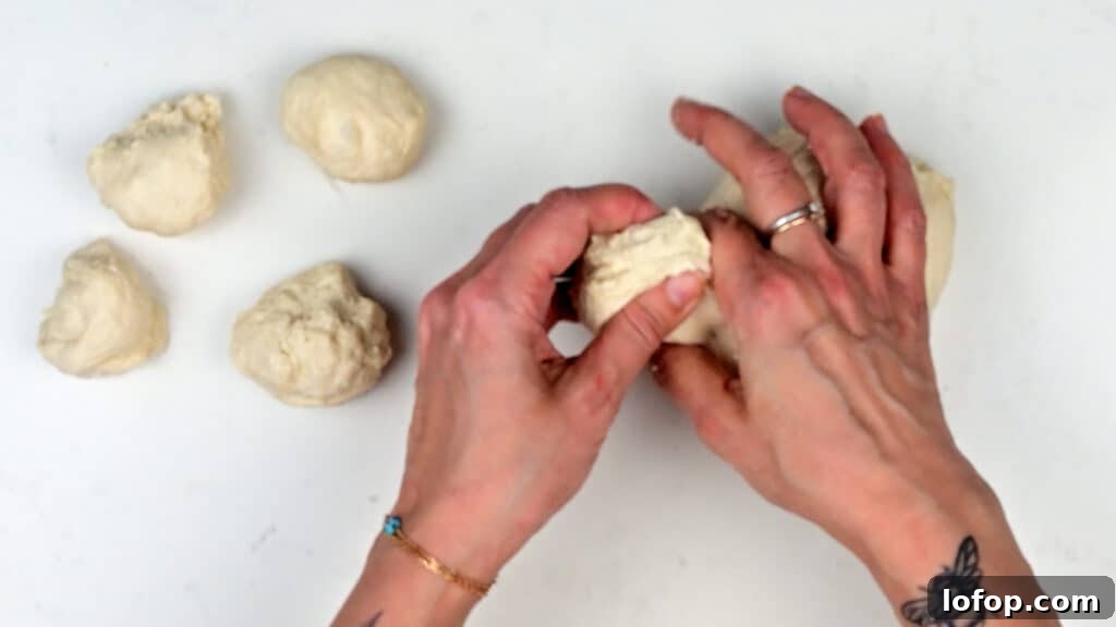 pinching small pieces of dough between fingers