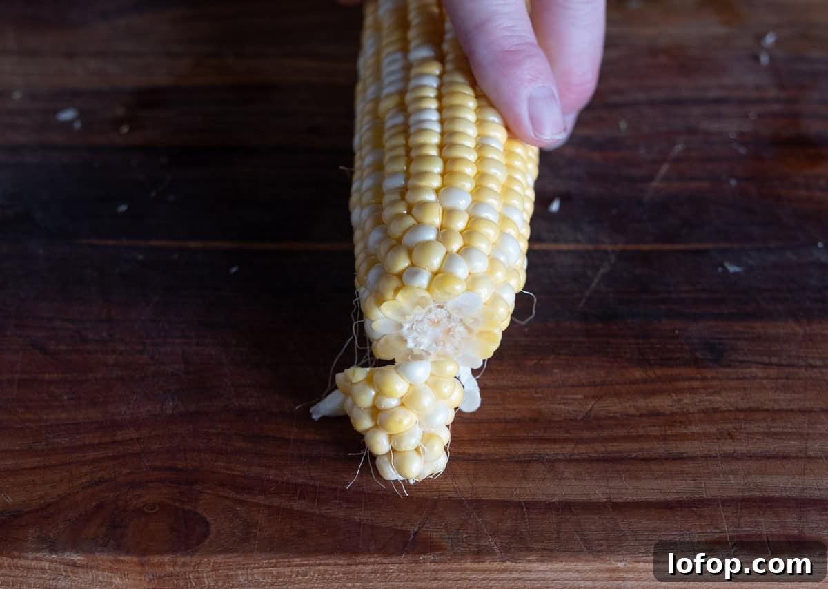 The tip removed from a corn cob in preparation for corn riblets.