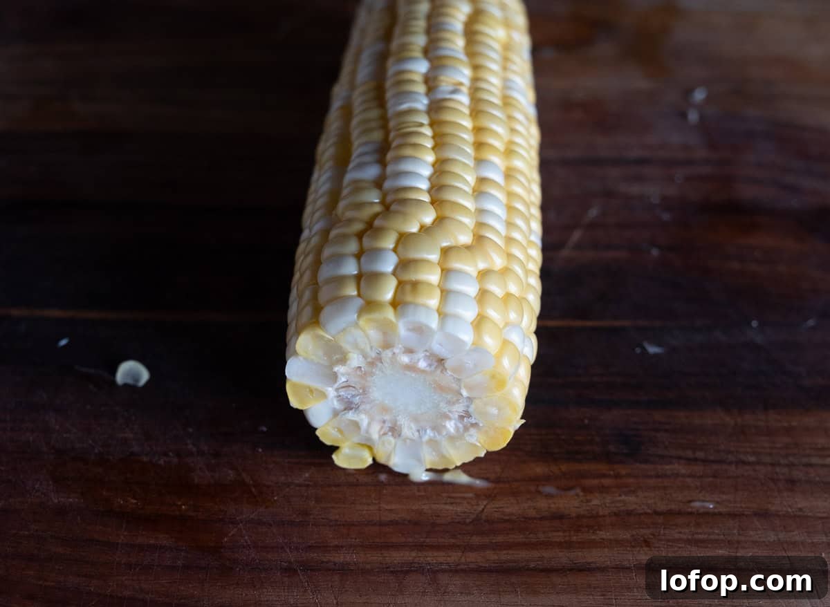Trimmed corn cob in preparation for corn ribs.