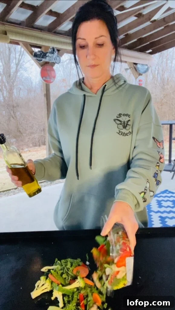 adding the vegetables to the griddle