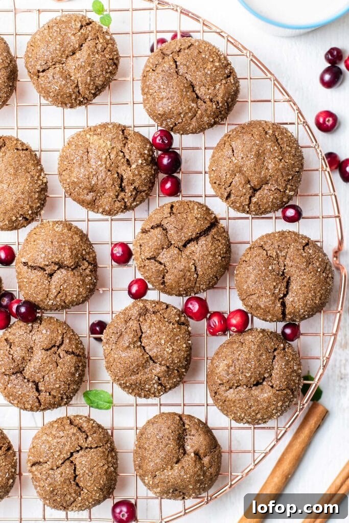 A photo of ginger sugar cookies cooling on a baking rack.