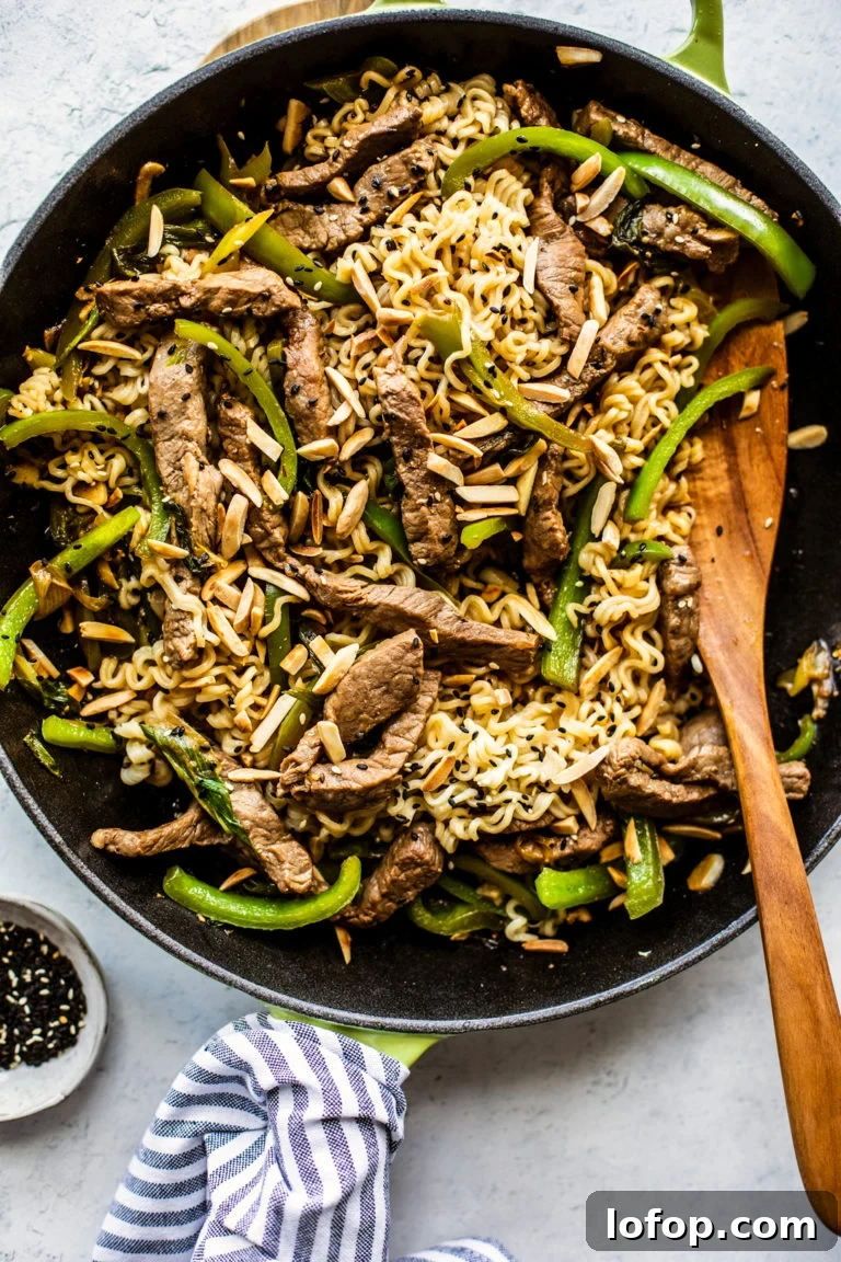 Skillet full of beef, peppers, and Ramen noodles.