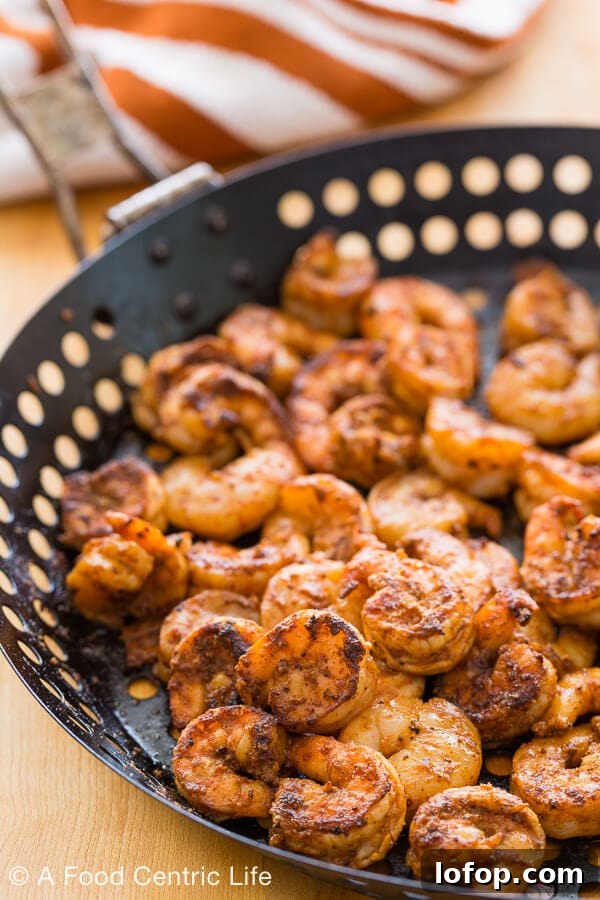 Baja Shrimp Tacos Recipe — Grilled or Stovetop Method 4 Grilled shrimp in a grilling basket waiting to make tacos.