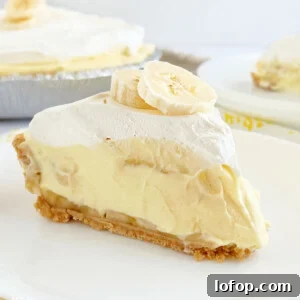no bake banana pudding pie in graham cracker crust with cool whip on top