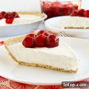slice of no bake cheesecake with cherries on top.