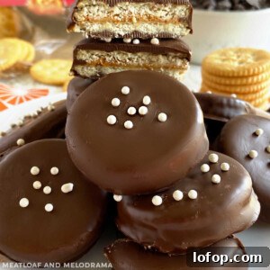 chocolate peanut butter ritz cookies with white candy on a plate