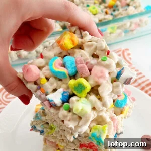 lucky charms marshmallow treats in hand