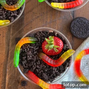 dirt pie cups with gummy worms and oreo cookies and pudding ( mud pie )