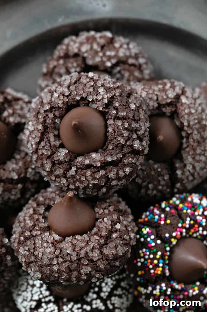 Gluten-Free Chocolate Kiss Cookies with Optional Peanut Butter 6 Overhead closeup image of a pile of gluten free chocolate kiss cookies on a platter.