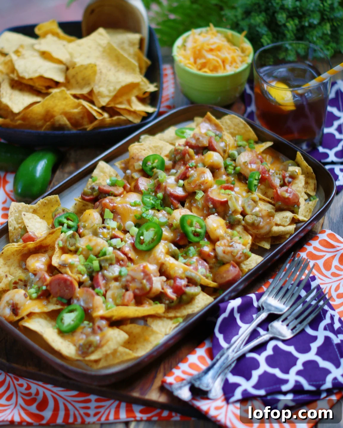 Louisiana Gumbo Nachos make great party food, game day food and tailgate food with shrimp, sausage and light roux.