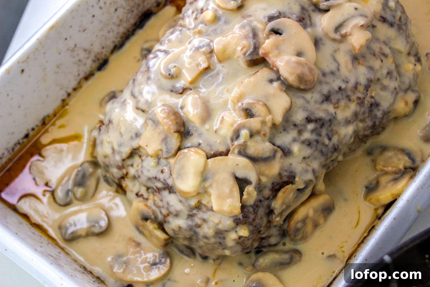 Savory Mushroom Meatloaf with Rich Mushroom Gravy 9 Creamy mushroom meatloaf in a pan