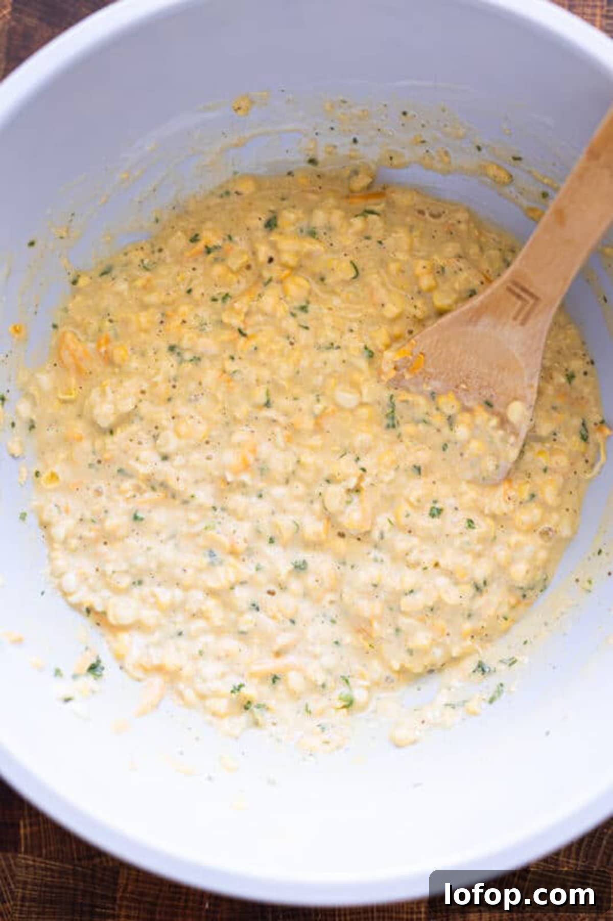 Corn fritter mixture in a bowl.