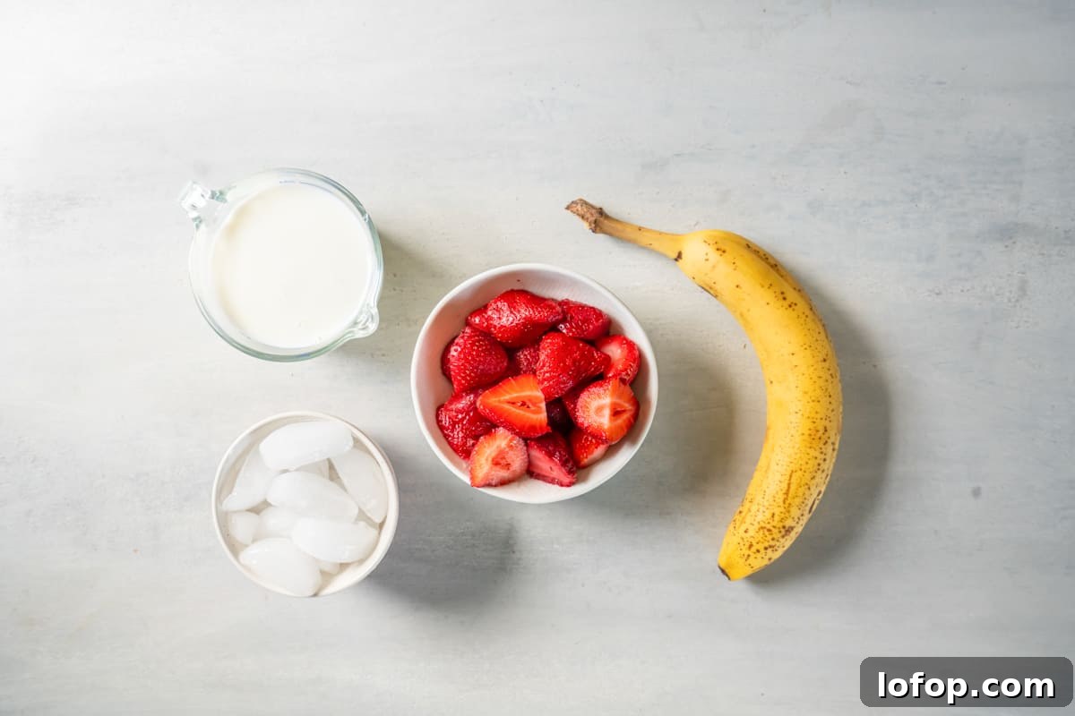 a bowl of strawberries, bananas, ice cream and milk.