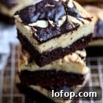 Decadent vegan chocolate brownie bars displayed on a cooling rack.