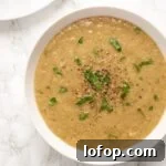 Roasted Broccoli Soup Recipe: Creamy Oven-Roasted Broccoli Bowl 6 AA close up view of a bowl of roasted broccoli soup.