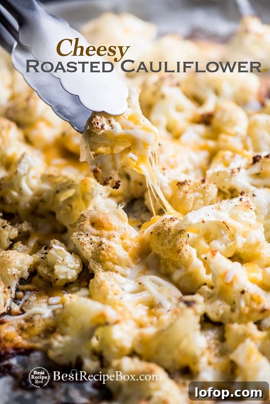 Cheesy Roasted Cauliflower Recipe is Low Carb and Delicious | @bestrecipebox Cheesy Roasted Cauliflower Recipe is Low Carb and Delicious on a bake sheet pan with tong