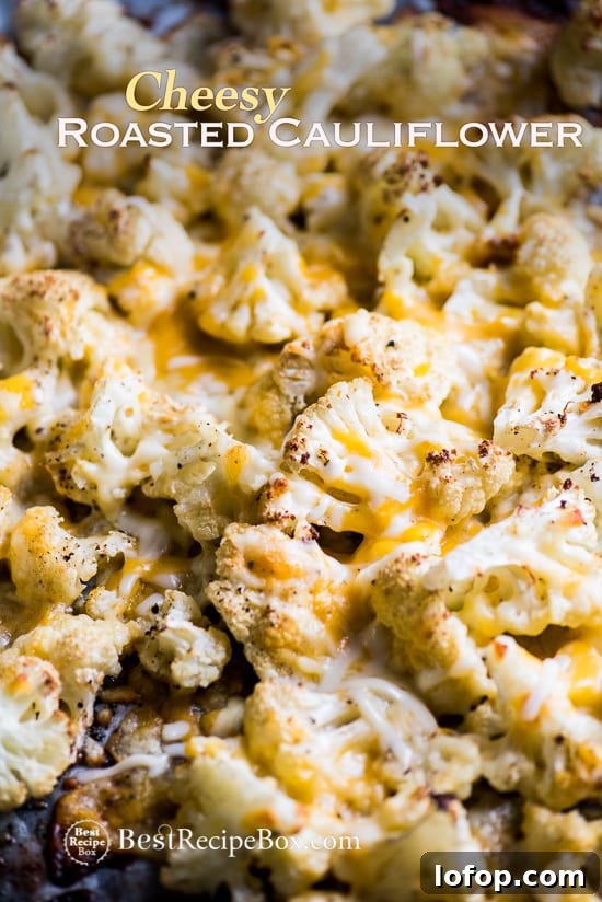 Cheesy Roasted Cauliflower Recipe is Low Carb and Delicious | @bestrecipebox Cheesy Roasted Cauliflower Recipe is Low Carb and Delicious on baking sheet pan