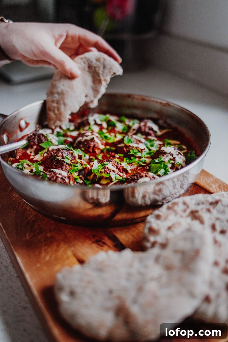 Falafel Shakshuka: Spiced Chickpea Patties in Tomato Egg Skillet 4 Falafel Shakshuka Served with Flatbreads - Vegan, GF & Healthy! Georgie Eats