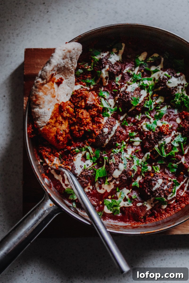 Falafel Shakshuka: Spiced Chickpea Patties in Tomato Egg Skillet 5 Falafel Shakshuka Served with Flatbreads - Vegan, GF & Healthy! Georgie Eats