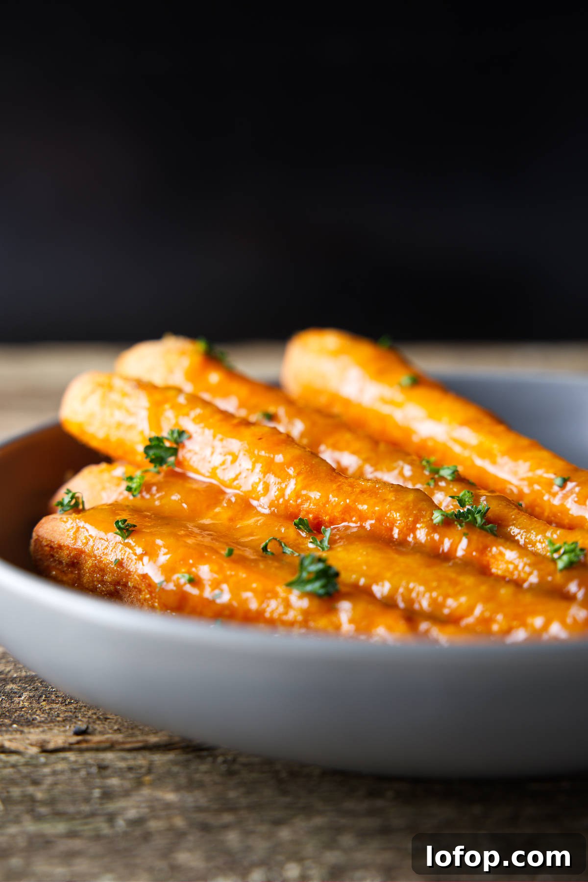 Smoked Carrots Recipe: Tender, Smoky Glazed Carrots in 30 Minutes 2 Glazed smoked carrots in a bowl.