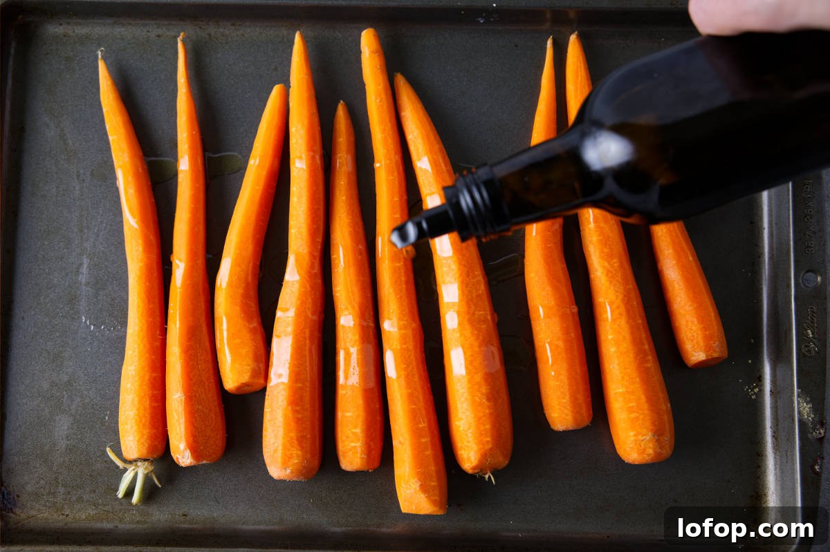Smoked Carrots Recipe: Tender, Smoky Glazed Carrots in 30 Minutes 5 Drizzling olive oil over carrots in a sheet pan.