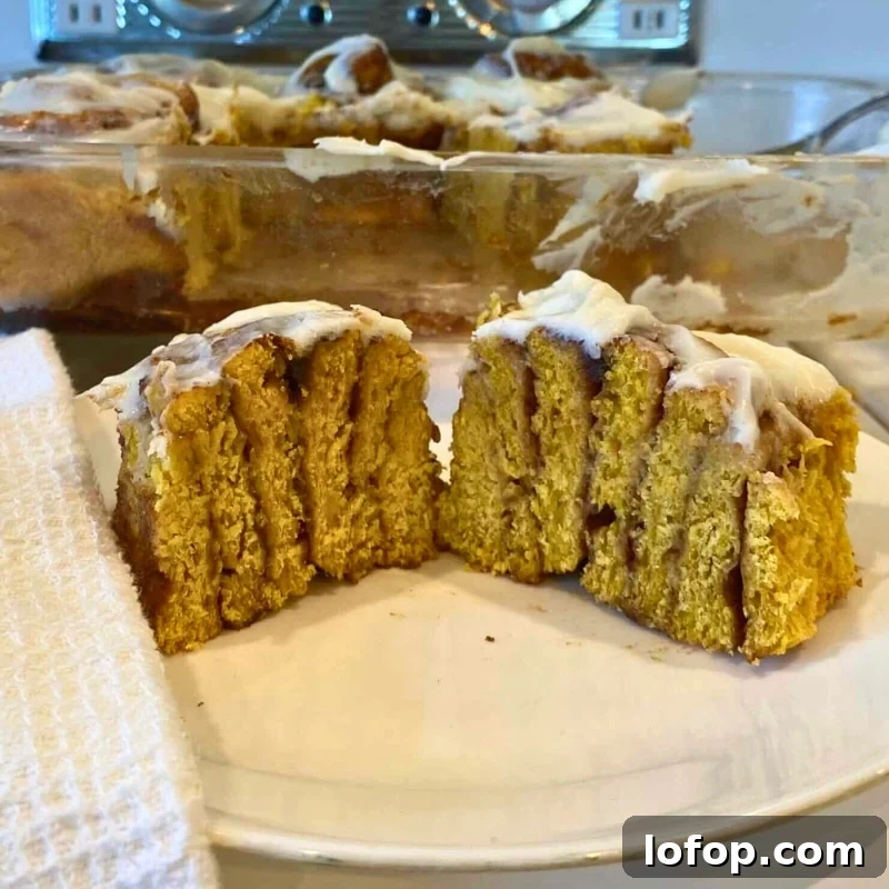 Soft Sourdough Pumpkin Cinnamon Rolls Recipe for Fall Baking 2 soft sourdough pumpkin cinnamon rolls sliced in half to show inside