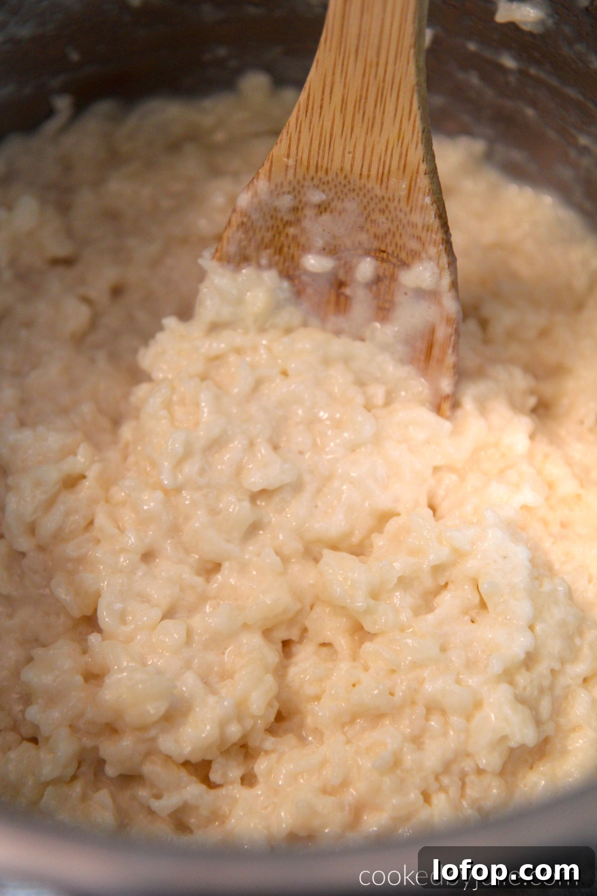 instant pot rice pudding and a wooden spoon.