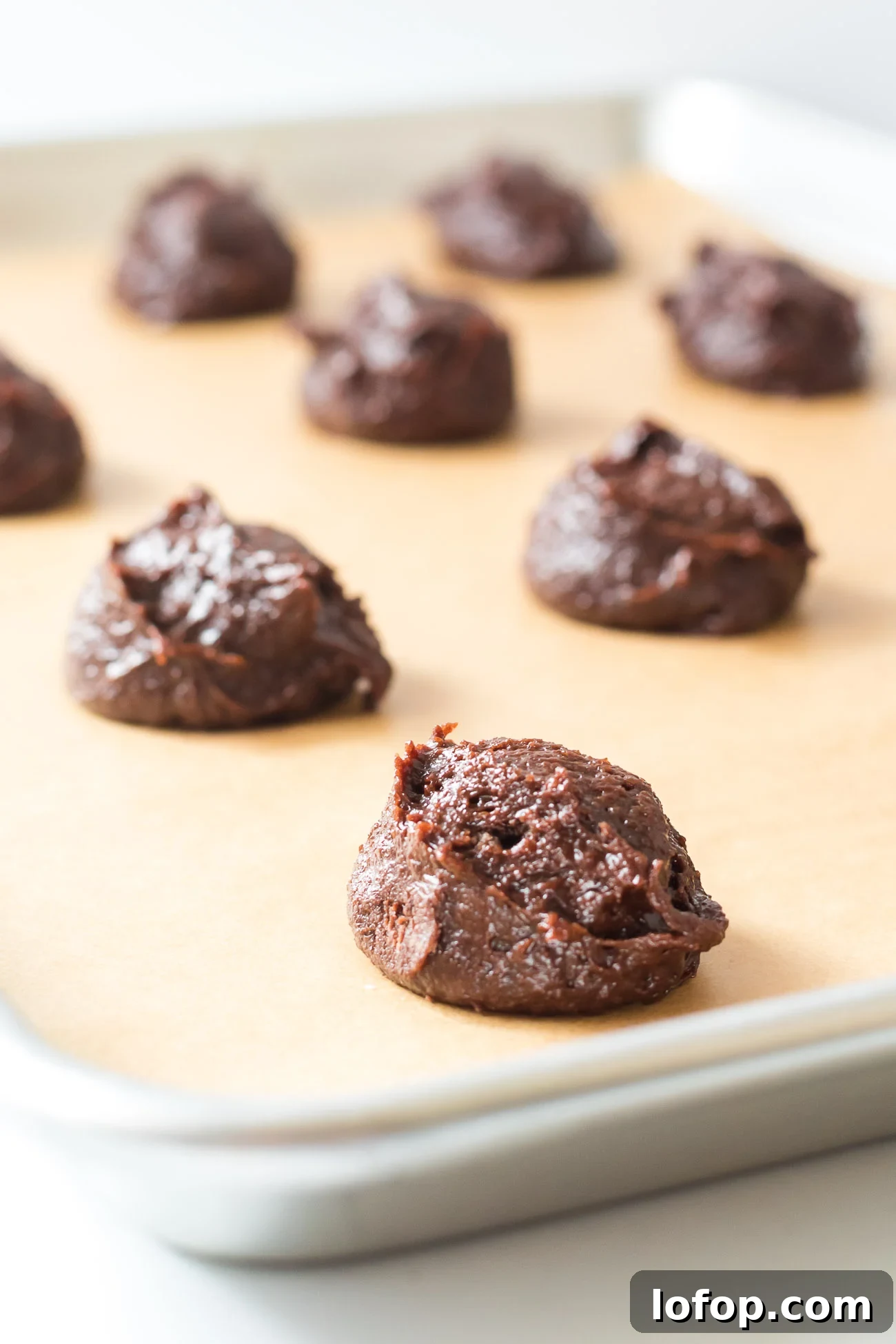 Cocoa Powder Cookie Recipe: Rich, Chewy Chocolate Cookies 6 chocolate drop cookies on a sheet
