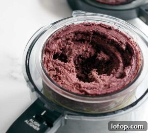 Vegan Blueberry Matcha Ice Cream Recipe (Ninja Creami, Dates & Oats) 12 Tunnel in Ninja Creami pint in outer container ready for a mix in!