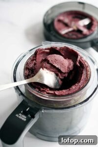 Vegan Blueberry Matcha Ice Cream Recipe (Ninja Creami, Dates & Oats) 13 Ice wall along edges of Ninja Creami pint