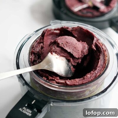 Vegan Blueberry Matcha Ice Cream Recipe (Ninja Creami, Dates & Oats) 8 Ice wall along edges of Ninja Creami pint